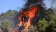 The Hermits Peak and Calf Canyon wildfire burns near Las Vegas, New Mexico, U.S. May 4, 2022. REUTERS/Kevin Mohatt/File Photo