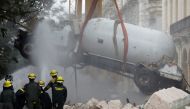A gas tanker truck is lifted from debris after an explosion hit the Hotel Saratoga, in Havana, Cuba May 6, 2022. REUTERS