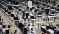 A staff member walks among computers at the Parish Pastoral Council for Responsible Voting (PPCRV), a command center of the election watchdog, a day prior to the national elections in Manila, Philippines, May 8, 2022. REUTERS/Willy Kurniawan