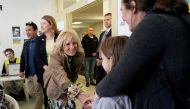 U.S. first lady Jill Biden greets a girl as she meets Ukrainian refugees and humanitarian workers at a city-run refugee center in Kosice, Slovakia, May 8, 2022. Susan Walsh/Pool via REUTERS
 