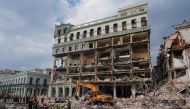 Machinery remove debris after an explosion hit the Hotel Saratoga in Havana, Cuba May 6, 2022. REUTERS/Alexandre Meneghini

