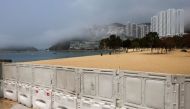Fences are placed to block access to Deep Water Bay beach during the coronavirus disease (COVID-19) pandemic, in Hong Kong, China, March 18, 2022. REUTERS/Tyrone Siu

