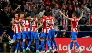 Atletico Madrid's Yannick Carrasco celebrates scoring their first goal with teammates REUTERS/Isabel Infantes
