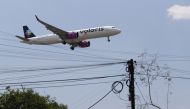 A Volaris airplane prepares to land on the airstrip at Benito Juarez international airport in Mexico City, Mexico, May 9, 2022. REUTERS/Edgard Garrido