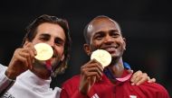 Gold medallists, Gianmarco Tamberi of Italy and Mutaz Essa Barshim of Qatar celebrate on the podium during the Tokyo Olympic Games, in this August 2, 2021 file photo.