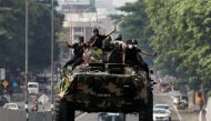 Army members travel on an armoured car on the main road after the curfew was extended for another extra day following a clash between anti-government demonstrators and Sri Lanka's ruling party supporters, amid the country's economic crisis, in Colombo, Sri Lanka, May 11, 2022. Reuters/Dinuka Liyanawatte