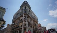 Emergency personnel stand in front of the Saratoga Hotel four days after it suffered an explosion in Havana, Cuba May 10, 2022. REUTERS/Alexandre Meneghini