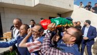Mourners, including journalists, carry the body of Al Jazeera reporter Shireen Abu Akleh May 11, 2022. Reuters/Mohamad Torokman