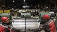 Workers roll steel products at Zaporizhstal, Ukraine's third-biggest metals plant, as Russia's invasion of Ukraine continues, in Zaporizhzhia, Ukraine, March 30, 2022. REUTERS/Marko Djurica


