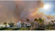 Smoke from a wildfire rises above a residential area in Laguna Niguel, Orange County, California, U.S. May 11, 2022 in this picture obtained from social media. Tim Wheaton/via REUTERS