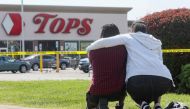 Mourners react while attending a vigil for victims of the shooting at a TOPS supermarket in BUFFALO, New York, U.S. May 15, 2022. REUTERS/Brendan McDermid TPX IMAGES OF THE DAY
