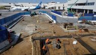 Workers prepare a cabling trench at a construction site at Los Angeles International Airport (LAX) in Los Angeles, California, U.S., March 30, 2022. Picture taken March 30, 2022. REUTERS/Chris Helgren/File Photo

