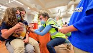 A child reacts while receiving a dose of the Pfizer-BioNTech coronavirus disease (COVID-19) vaccine at Smoketown Family Wellness Center in Louisville, Kentucky, U.S., November 8, 2021. REUTERS/Jon Cherry/


