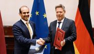 Minister of State for Energy Affairs H E Saad Sherida Al Kaabi (left), with the German Minister for Economic Affairs and Climate Action H E Dr. Robert Habeck during the signing ceremony, yesterday.  
