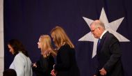 Incumbent Prime Minister Scott Morrison, leader of the Australian Liberal Party, leaves the stage with his wife Jenny and daughters Lily and Abbey, after addressing supporters and conceding defeat in the country's general election in Sydney, Australia, on May 21, 2022. (REUTERS/Loren Elliott)