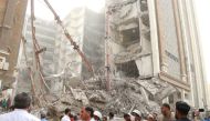 Iranians gather at the site of a ten-storey building collapse in Abadan, Iran May 23, 2022. WANA (West Asia News Agency) via REUTERS ATTENTION EDITORS - THIS IMAGE HAS BEEN SUPPLIED BY A THIRD PARTY.
