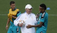 Real Madrid's Eden Hazard, coach Carlo Ancelotti and Eder Militao during training REUTERS/Susana Vera
