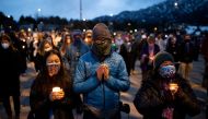 Hundreds gather at Fairview High School for a candlelight vigil to remember the victims of a mass shooting that left 10 dead at King Soopers grocery store in Boulder, Colorado, U.S. March 25, 2021. REUTERS/Alyson McClaran/File Photo

