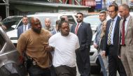 New York subway shooting suspect Andrew Abdullah is escorted by New York City Police (NYPD) Detectives in to a Police Precinct in New York City, U.S., May 24, 2022. REUTERS/Brendan McDermid
