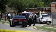 Law enforcement officers guard the scene of a shooting at Robb Elementary School in Uvalde, Texas, U.S. May 24, 2022. REUTERS/Marco Bello