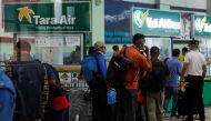 A group of mountaineers wait to board a flight as they head to search and rescue of a plane operated by Tara Air that went missing on Sunday with 22 people on board, while on its way to Jomsom, in Kathmandu, Nepal May 29, 2022. REUTERS/Navesh Chitrakar