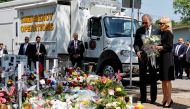 U.S. President Joe Biden and first lady Jill Biden, who holds a bouquet of 21 white flowers, pay their respects at the Robb Elementary School memorial, where a gunman killed 19 children and two teachers in the deadliest U.S. school shooting in nearly a decade, in Uvalde, Texas, U.S. May 29, 2022. REUTERS/Jonathan Ernst

