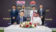 President of Huawei Gulf North Liam Zhao and UDC Executive Director Commercial Hussain Akbar Al Baker with other officials during the agreement signing ceremony.