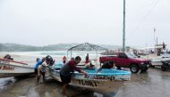 Fishermen pull a boat out of the water as Hurricane Agatha moves towards the southern coast of Mexico, in Puerto Escondido, Oaxaca state, Mexico, May 30, 2022. REUTERS/Jose de Jesus Cortes
