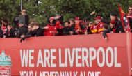 Liverpool's Mohamed Salah and teammates on board an open top bus during the victory parade REUTERS/Phil Noble

