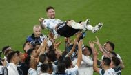 Argentina's Lionel Messi is toosed by with teammates REUTERS/John Sibley