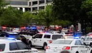 Emergency personnel work at the scene of a shooting at the Saint Francis hospital campus, in Tulsa, Oklahoma, June 1, 2022. REUTERS/Michael Noble Jr. 