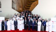 Matthieu Bouyer, Country Chair and Managing Director TotalEnergies EP Qatar with other officials and students pose for a group photo.