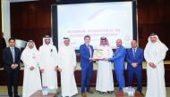 Dominic Genetti, President and General Manager of ExxonMobil Qatar, Khalid bin Khalifa Al Thani, Chief Executive Officer of Qatargas, and Ziad Yehya, Qatargas’ Corporate Planning and Enterprise Risk Manager and Leader of the Qatargas’ COVID-19 Taskforce, with other officials during the recognition ceremony. 