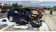 FILE PHOTO: Rescue workers attend the scene where a Tesla electric SUV crashed into a barrier on U.S. Highway 101 in Mountain View, California, March 25, 2018. KTVU FOX 2/via REUTERS

