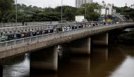 Three-wheeler drivers wait in a queue to buy petrol due to fuel shortage, amid the country's economic crisis, in Colombo, Sri Lanka, on June 17, 2022. Reuters