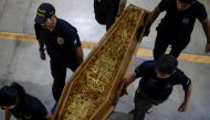 Federal Police officers carry a coffin containing human remains after a suspect confessed to killing British journalist Dom Phillips and Brazilian indigenous expert Bruno Pereira and led police to the location of remains, at the headquarters of the Federal Police, in Brasilia, Brazil, June 16, 2022. REUTERS/Ueslei Marcelino