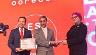 CEO of Ooredoo Algeria Bassam Yousef Al Ibrahim receiving the certification and award