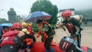 Rescue workers evacuate flood-affected residents with a dinghy following heavy rainfall in Yongfu county of Guilin, Guangxi Zhuang Autonomous Region, China June 17, 2022. cnsphoto via Reuters