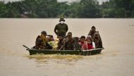 Indian Army soldiers evacuate people from flooded area to a safer place after heavy rains at a village in Hojai district, in the northeastern state of Assam, India, June 18, 2022. REUTERS/Anuwar Hazarika
