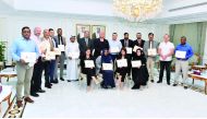 Participants with their certificates of course completion at the Qatar Chambers headquarters, in Doha, recently. 