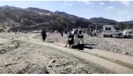 People carry injured to be evacuated following a massive earthquake, in Paktika Province, Afghanistan, June 22, 2022, in this screen grab taken from a video. BAKHTAR NEWS AGENCY
