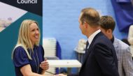 Liberal Democrats party candidate Richard Foord shakes hands with Conservative party candidate Helen Hurford afters results announced his win in the Tiverton and Honiton by-election, at Lords Meadow Leisure Centre in Devon, Britain, June 24, 2022. (REUTERS/Paul Childs)