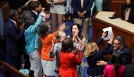 House of Representatives Democrats celebrate after passing of the 