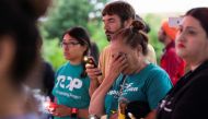 Maria Victoria de la Cruz reacts during a vigil for migrants who were found dead inside a trailer truck in San Antonio, Texas, U.S., June 28, 2022. Reuters/Kaylee Greenlee Beal