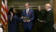Judge Ketanji Brown Jackson takes her judicial oath of office as an Associate Justice of the US Supreme Court, as her husband Patrick Jackson holds the Bible in a framegrab from handout video provided by the Supreme Court, in Washington, US, on June 30, 2022. (Reuters)