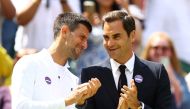 Serbia's Novak Djokovic (left) and Switzerland's Roger Federer during centre court centenary celebrations at the All England Lawn Tennis and Croquet Club, London, Britain, on July 3, 2022. (Reuters/Hannah Mckay)