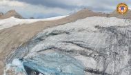A handout photo from Alpine rescue services shows where an ice glacier collapsed on Marmolada mountain, Italy, July 3, 2022. (Reuters)

