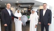 Deputy CEO of Dar Al Sharq Group Jaber Al Harami, with other officials, hands over the key of 2021 Mini Cooper to Mohamed Mubarak Al Shahwani, winner of the ‘Browse and Win’ campaign.  PIC: Amr Diab 
