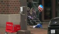 A child's stroller with a stars and stripes balloon attached is left after gunfire erupted at a Fourth of July parade route in the wealthy Chicago suburb of Highland Park, Illinois, US, on July 4, 2022 in a still image from video. (Reuters)