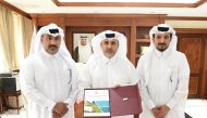 Minister of Municipality H E Abdullah bin Abdulaziz bin Turki Al Subaie (centre) during the launch of the book of the Executive Report of the Agricultural Census in Qatar for the year 2021, yesterday. 